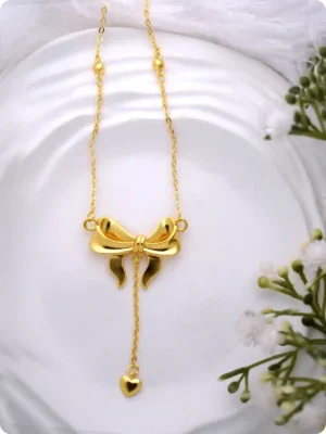 Elegant Bow Pendant Necklace in Gold Finish